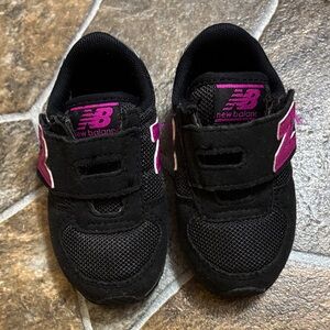 New Balance Kids Black Sneakers with Pink Accents